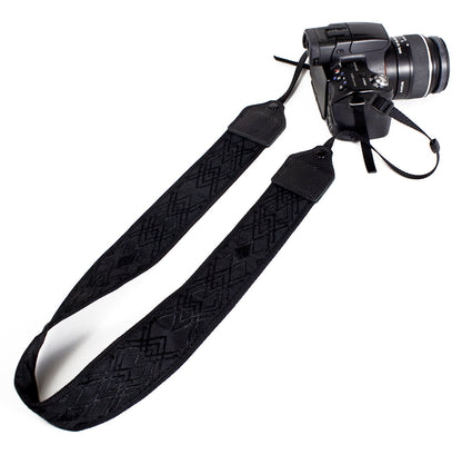 Black / black geometric jacquard camera strap.