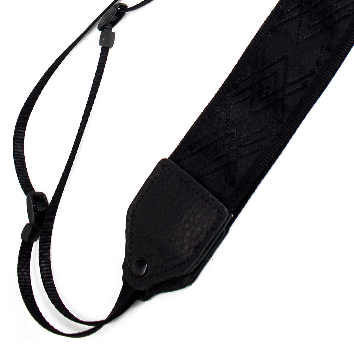 Black / black geometric jacquard camera strap.