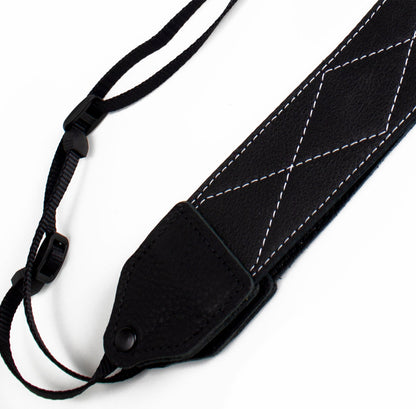 Black / white stitched leather camera strap.