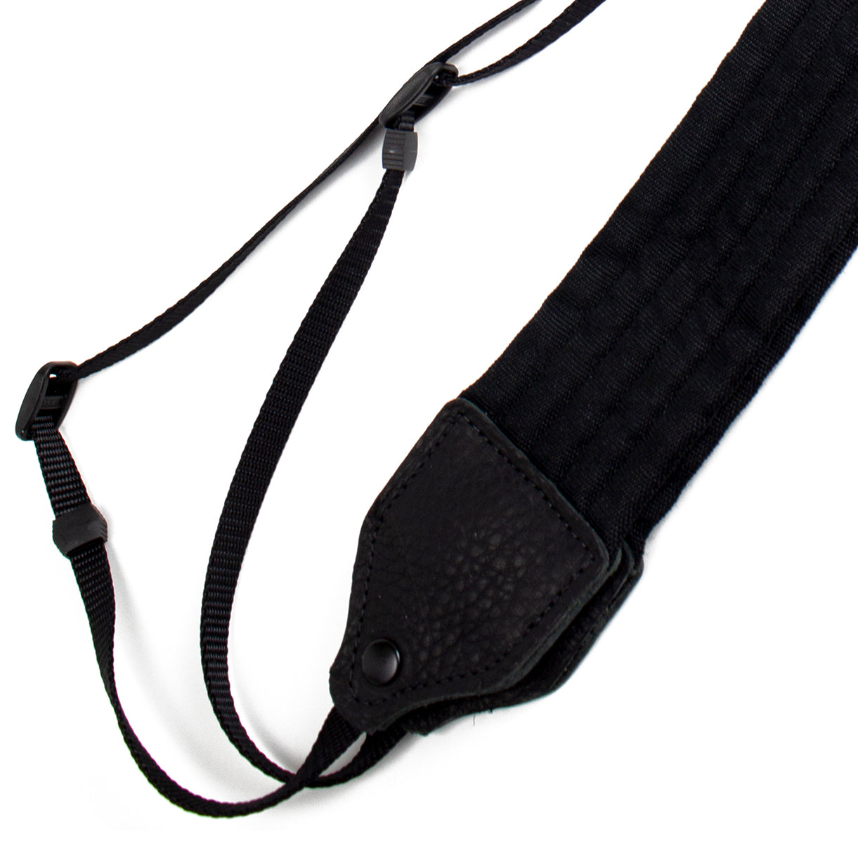 Black pleated nylon camera strap.