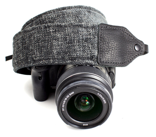 Gray wool camera strap.