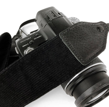 Black corduroy camera strap.