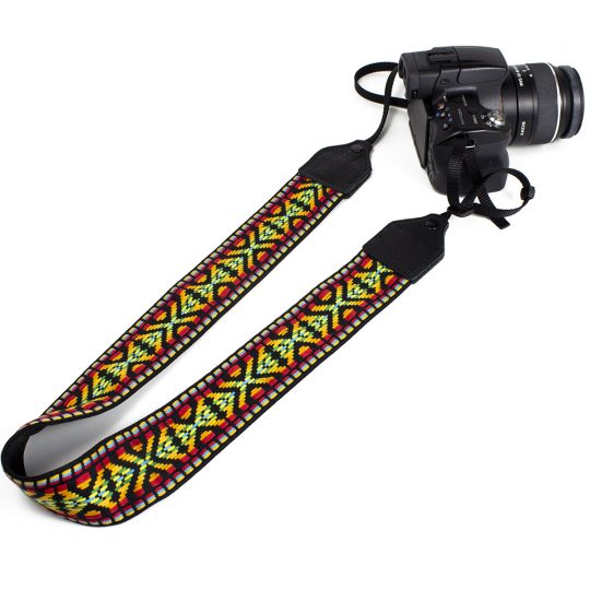 Yellow / red geo jacquard camera strap.