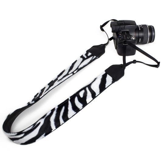 Black / white zebra faux fur camera strap.