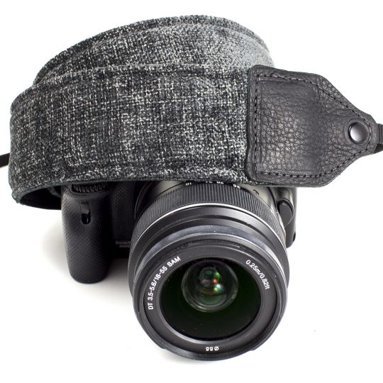Gray wool camera strap.